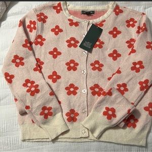 Size small, cute button up sweater, soft material with large orange flowers.